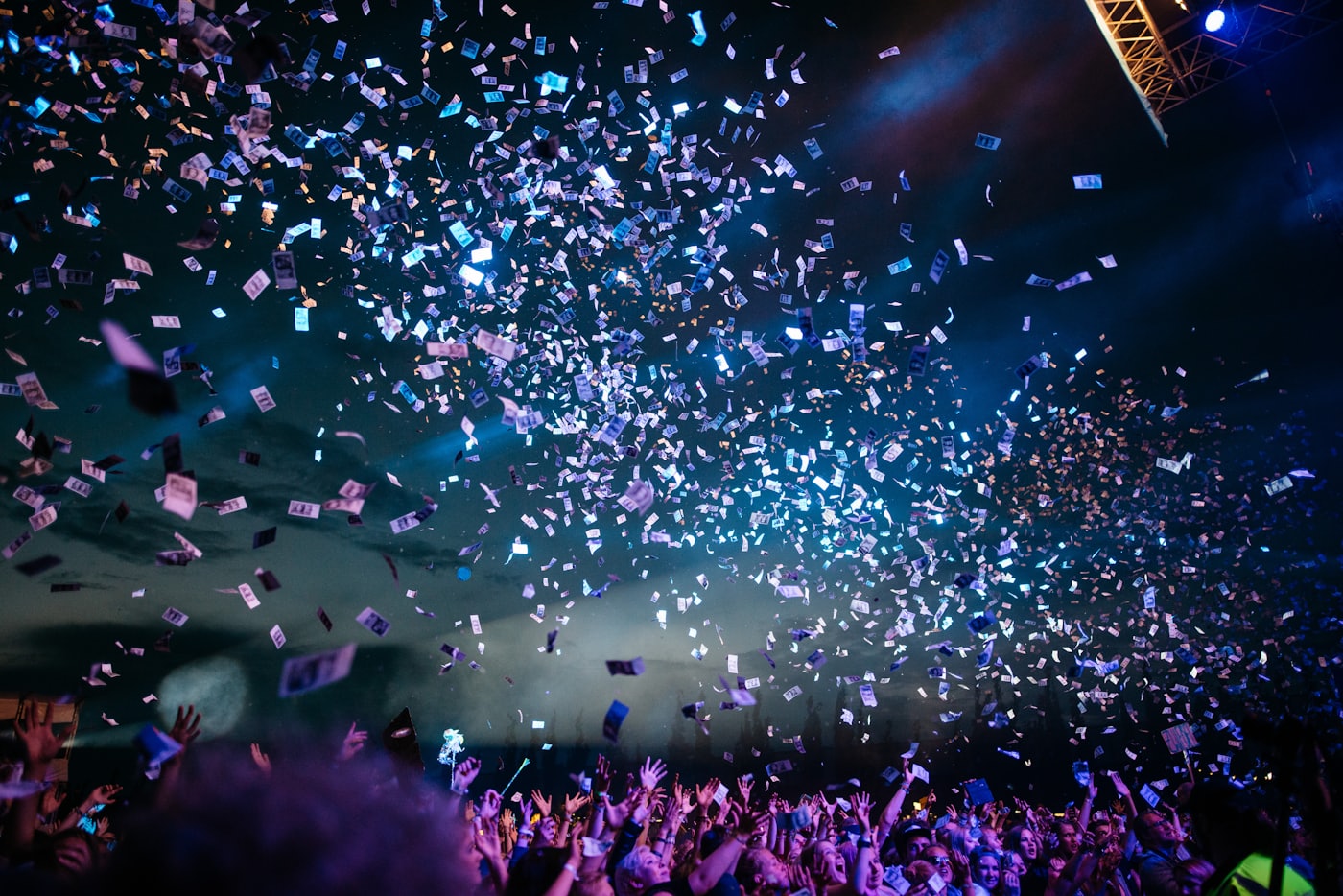 Crowd celebrating under confetti